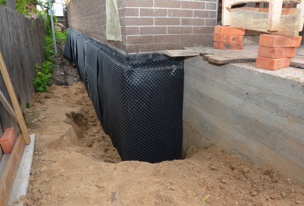SJ Waterproofing Pros technician performing targeted Exterior Waterproofing assessment in Urbana, MD